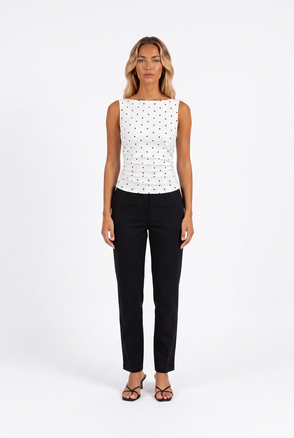 White polka-dot boat-neck sleeveless top with tie back — front